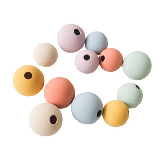 Colorful silicone beads on a white background