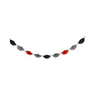 Decorative garland with black, white, and red fan-shaped flags on a white background