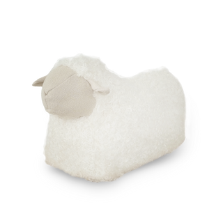 White sheep-shaped pillow on a white background