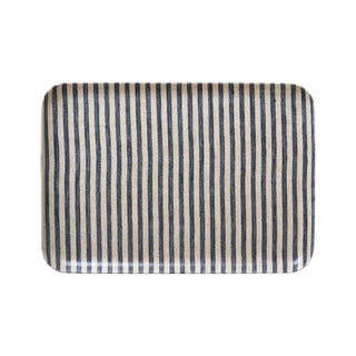 Rectangular tray with black and white striped pattern on a white background