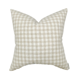 Gingham pillow with a beige and white pattern on a white background