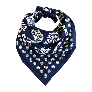 Navy blue bandana with white floral patterns on a white background