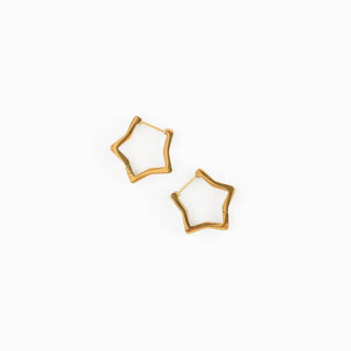 Gold geometric hoop earrings on a white background