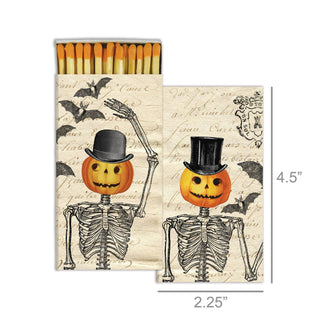 Matches with Halloween design of skeletons and pumpkins on a vintage-style matchbox.
