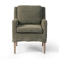 Green armchair with wooden legs on a white background