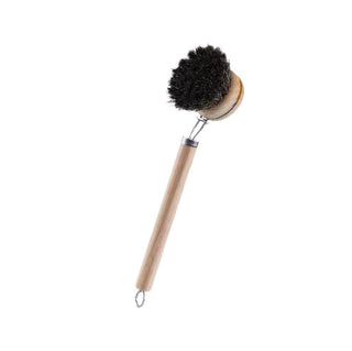 Dish brush with wooden handle and black bristles on a white background