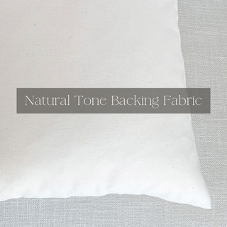 White pillow on a gray fabric background with 'Natural Tone Backing Fabric' text overlay.