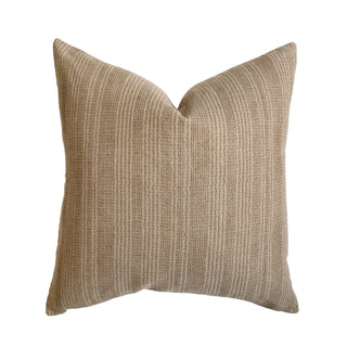 Textured beige pillow on a white background