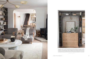 Living room with gray chairs and a bookshelf, featuring a wicker cabinet.