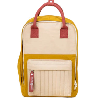 Backpack with red straps and beige accents on a beige background