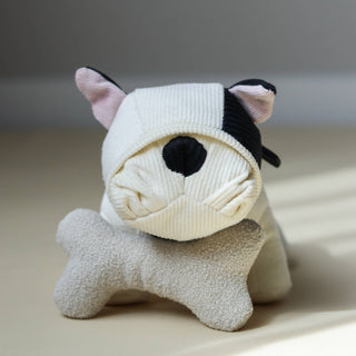 Stuffed animal toy resembling a cat with a sock over its head on a light surface.