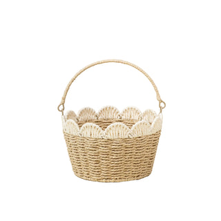 Woven basket with scalloped edge on a beige background