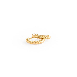 Gold hoop earrings on a white background