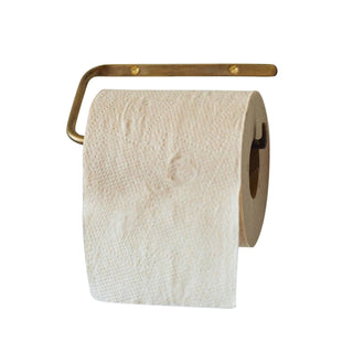 Toilet paper roll on a brass holder against a white background