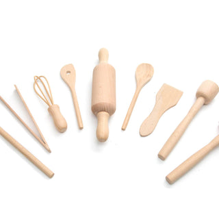 Set of wooden kitchen utensils including a rolling pin, spatulas, and spoons on a white background
