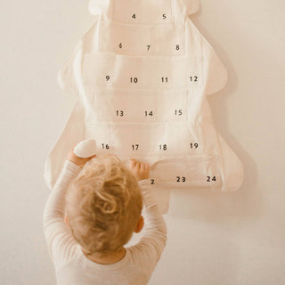 Child looking at a calendar with numbers on a light background