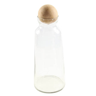 A tall, clear glass decanter with a raw mango wood lid, isolated on a white background.