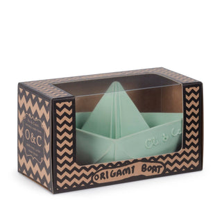Green origami boat in a decorative box with 'O&C' branding.