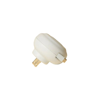 White plug on a beige background