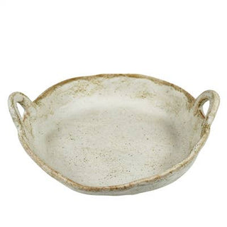 Beige ceramic dish with handles on a white background