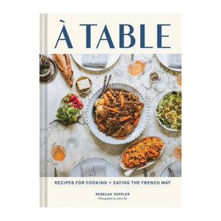 Book cover of 'À Table' with a photograph of a dining table setting featuring food.