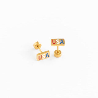Gold 'USA' earrings on a white background