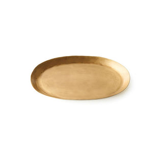 A gold-colored oval brass tray on a plain background.