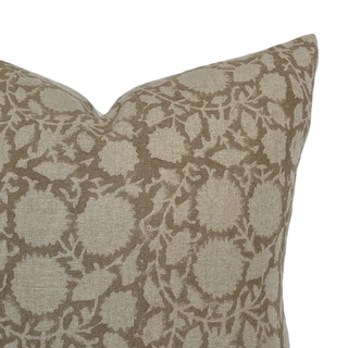 Patterned pillow with a floral design on a beige background