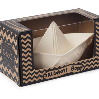 Origami boat in a decorative box with chevron pattern