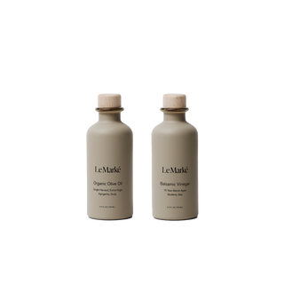 Two Le Marke bottles on a white background
