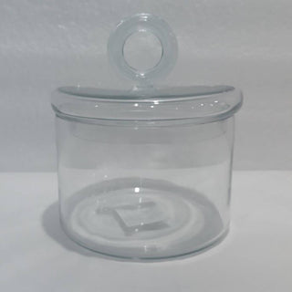 Clear glass jar with a lid on a white background