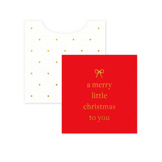 Red card with gold text 'a merry little Christmas to you' and a white envelope with gold dots on a white background.