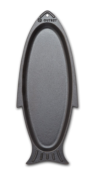 Black fish-shaped cutting board with 'Outset' branding on a white background
