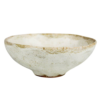 Ceramic bowl with a textured surface on a white background