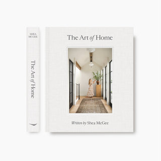 Book titled 'The Art of Home' by Shea McGee on a white background