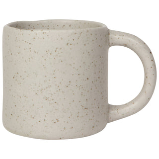 Speckled beige ceramic mug on a white background