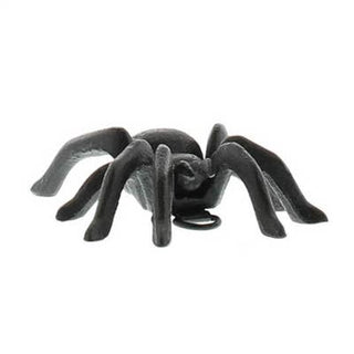 Black cast iron spider on a white background