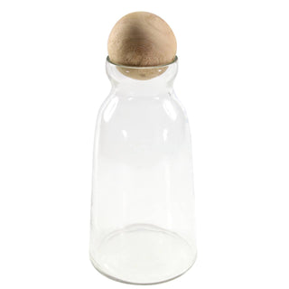 A clear glass decanter with a mango wood lid, isolated on a white background.