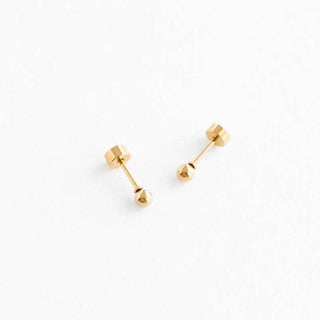 Pair of gold stud earrings on a white background
