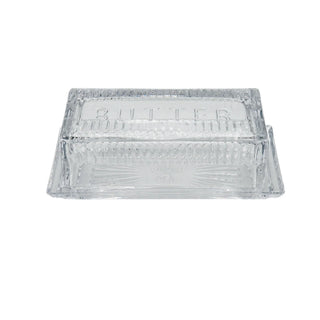 Clear glass butter dish with 'Butter' text on a white background