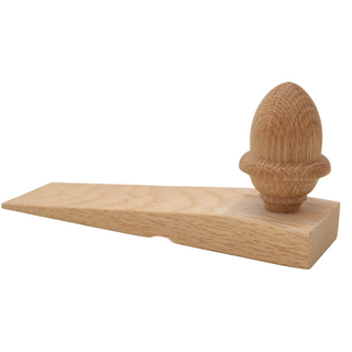 Wooden door stopper with acorn design on a white background