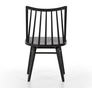 Black chair with woven seat on a white background