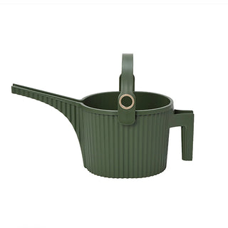 Green watering can with handle on a white background