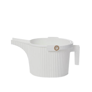 White ceramic teapot with a ribbed texture on a white background