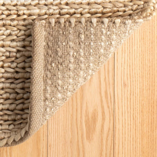 Close-up of a woven mat on a wooden floor