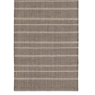 Textured woven mat with a striped pattern on a white background