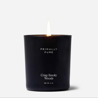 Black candle labeled 'Primally Pure' with a white background