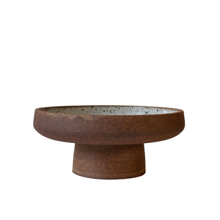 Rust-colored ceramic bowl on a white background