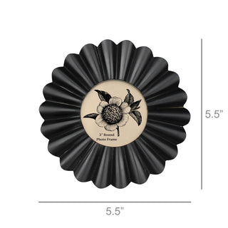 Black round photo frame with floral design and measurements on a white background
