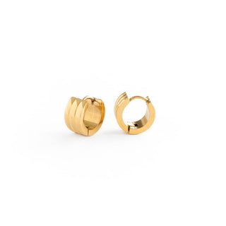 Gold hoop earrings on a white background